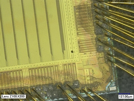 Area having a foreign particle on an IC chip (200x)